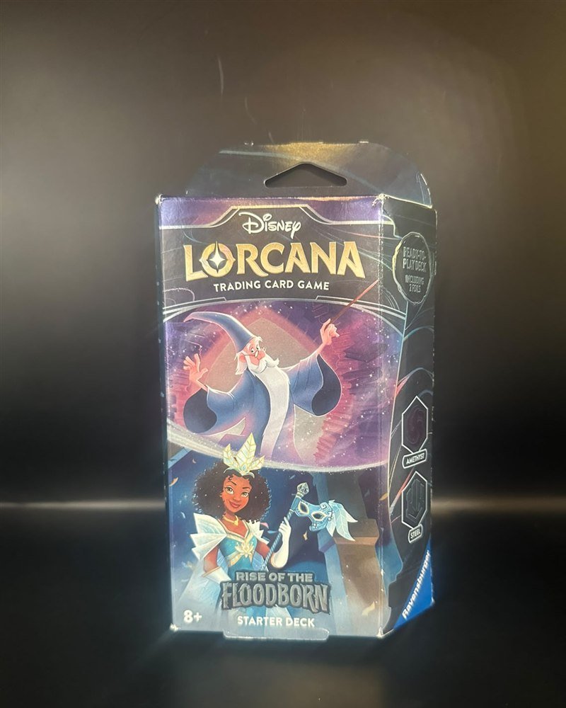 Mazo sellado Amethyst & Steel (Merlin y Tiana): 60 cartas con 2 foil, más 1 sobre de 12 cartas
